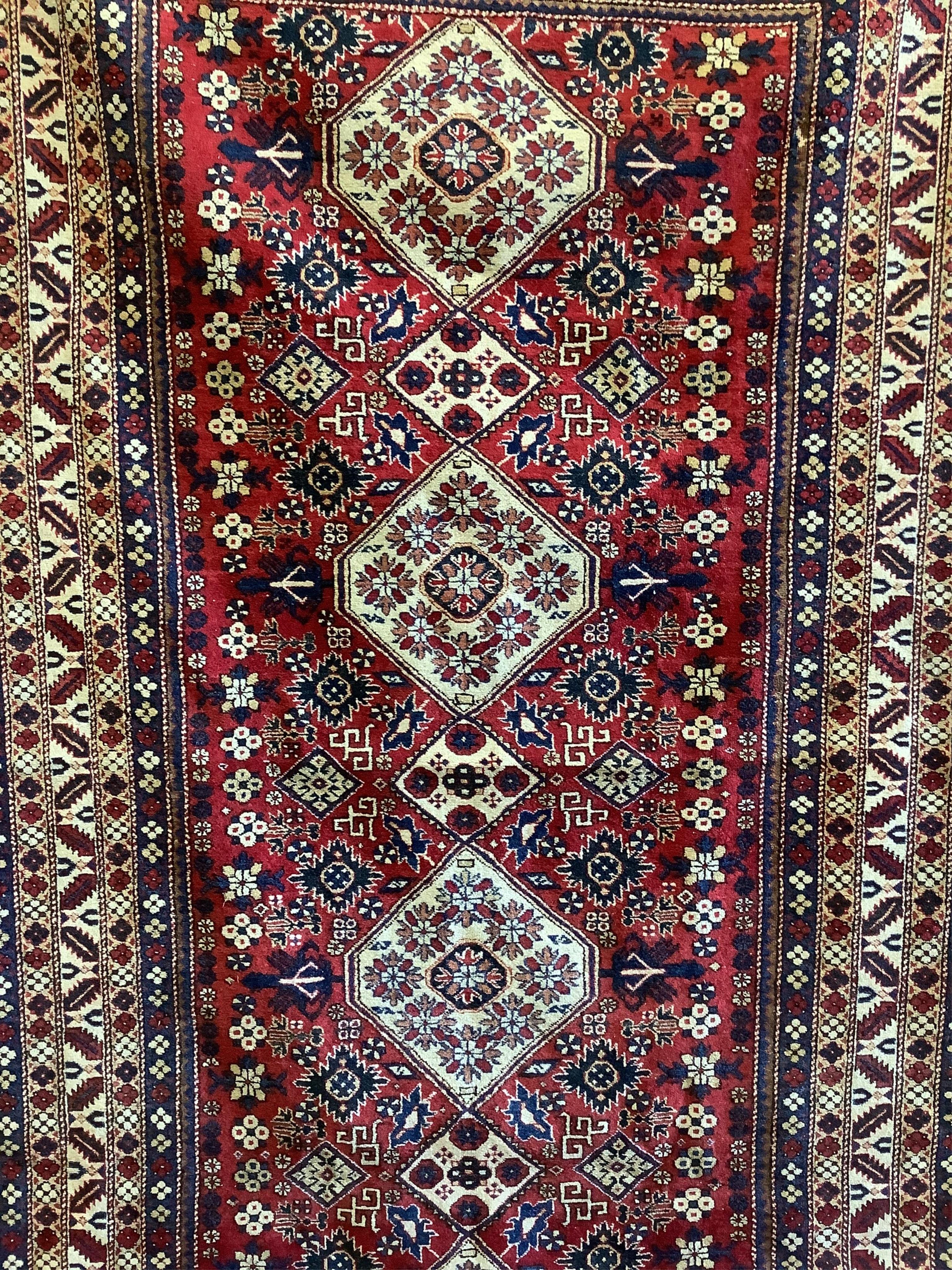 A Kazak red ground rug, 280 x 163cm. Condition - good